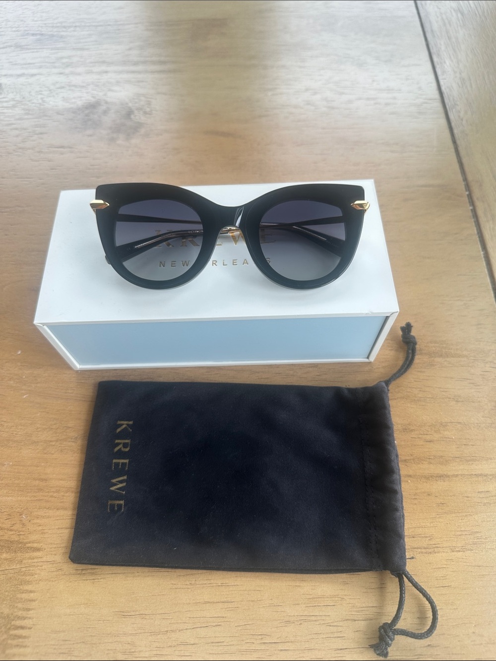 KREWE Black Cat-Eye Sunglasses with Gold Accents and Gradient Lenses